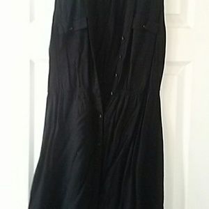 Black sleeveless mini button up dress